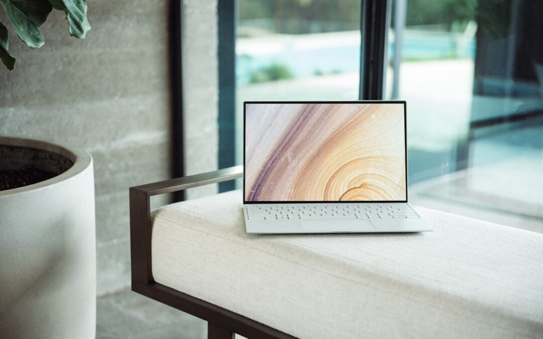 Creator at a laptop with a crypto payment setup for an adult content business