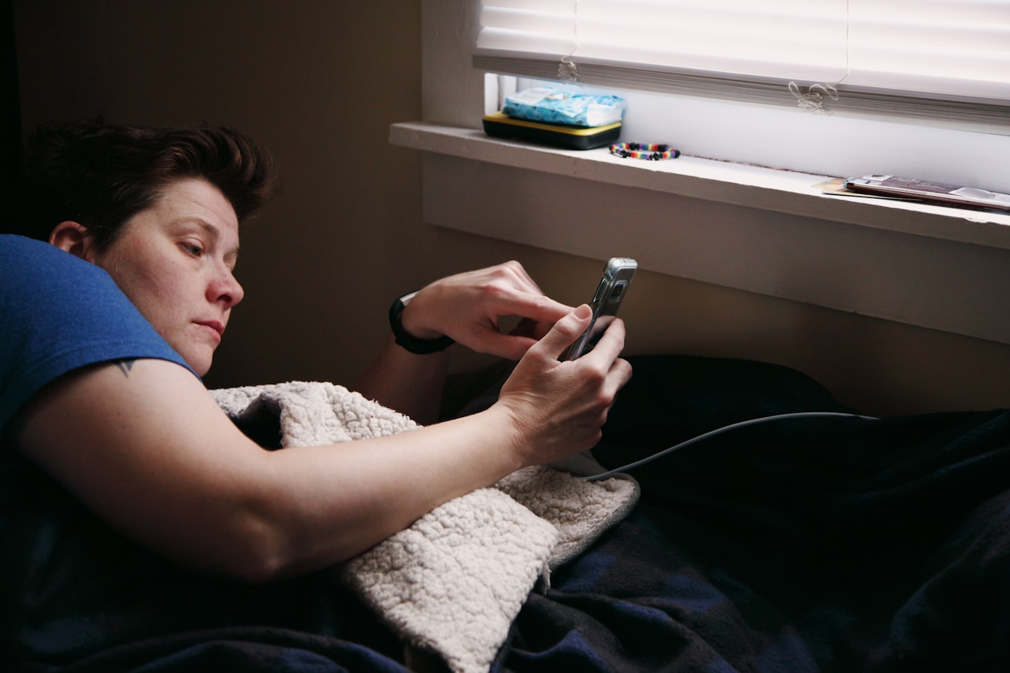 Frustrated mobile user looking at a phone, representing inconsistent Chai NSFW bot replies, weak memory, and roleplay breaks