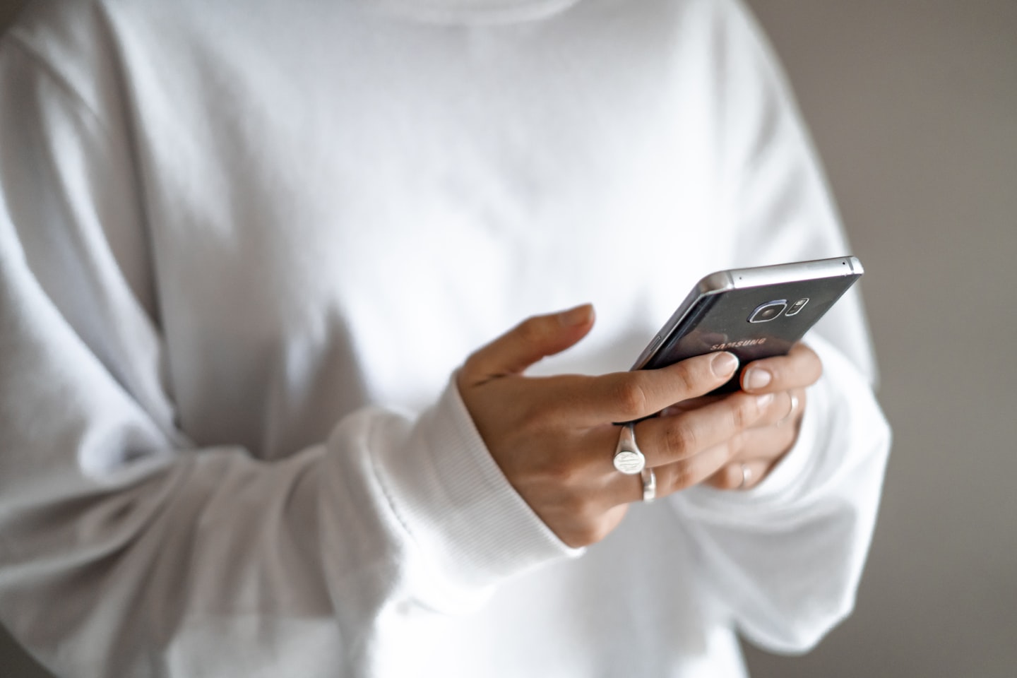 Smartphone showing subscription access and paid creator content for a fan-based platform