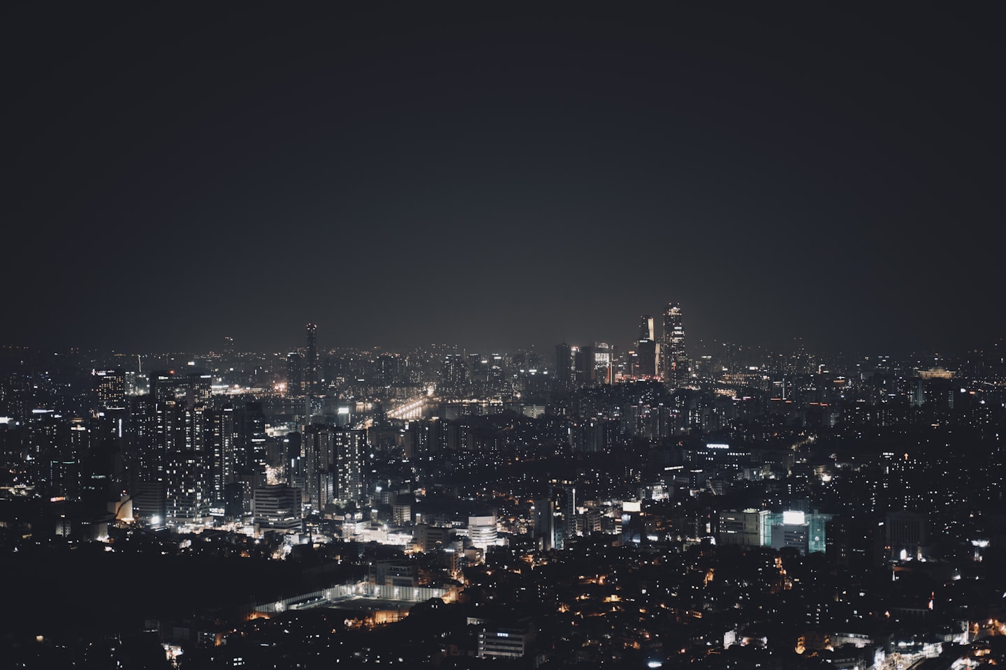 City lights scene representing location strategy and broader dating-app reach