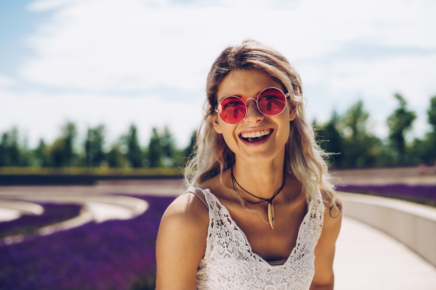 A smiling creator in a lifestyle setting that suggests a positive fan relationship and the kind of moment when
