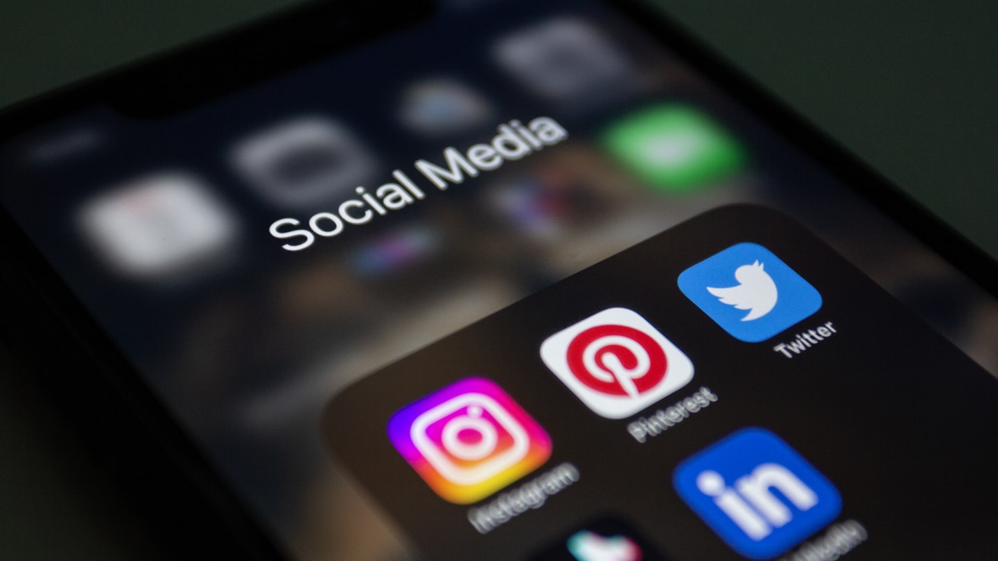 Social media promotion scene illustrating how OnlyFans shoutouts work as a traffic channel