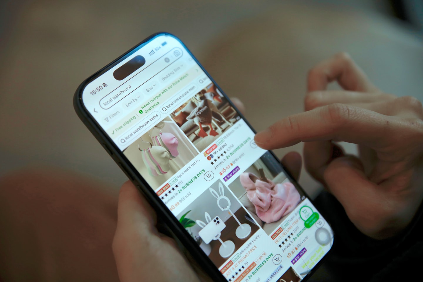 Person browsing an online marketplace to compare platforms for selling AI-generated art