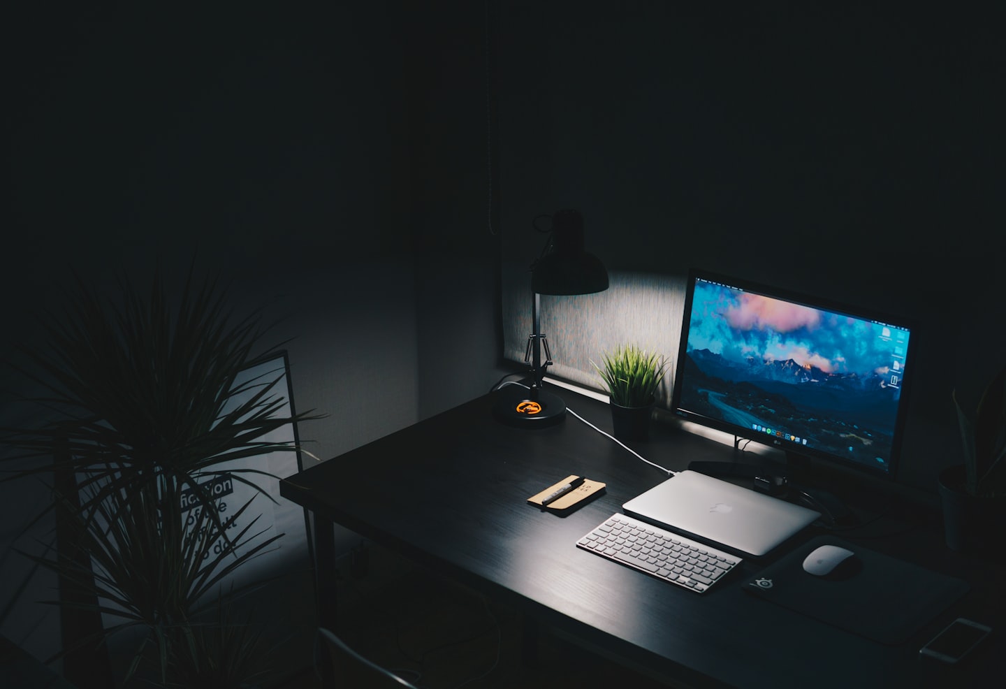 Desk setup with a laptop and monitor showing an adult site launch workflow