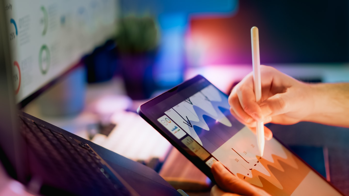 A modern analytics dashboard on a laptop, showing the business side of popularity, retention, and subscriber growth.