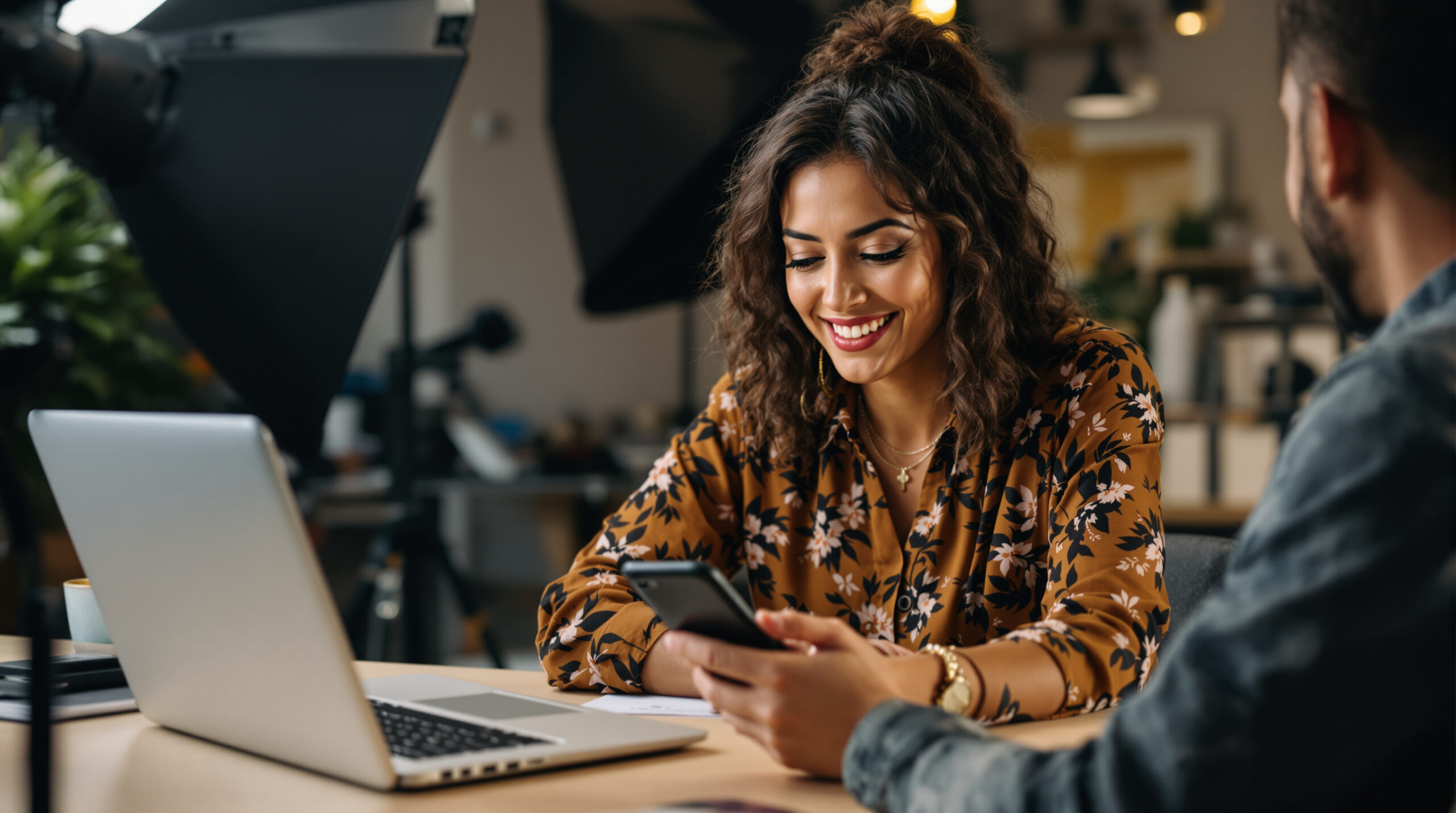 Creator comparing OnlyFans performance across laptop and phone